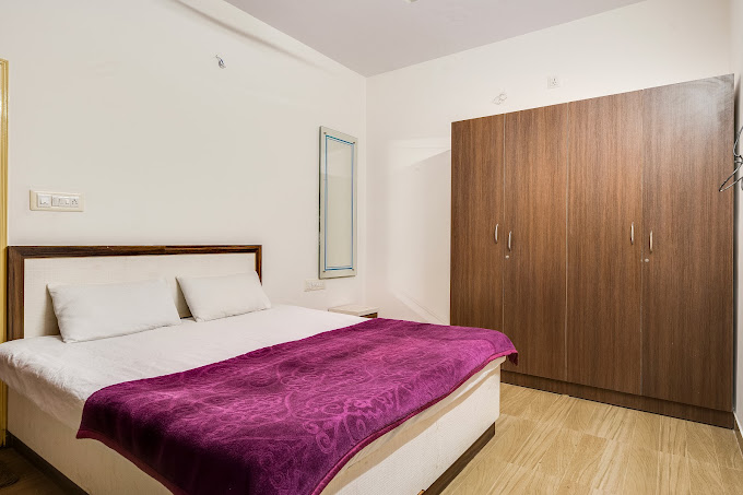 Private room at Gani Farms with rustic decor and modern amenities