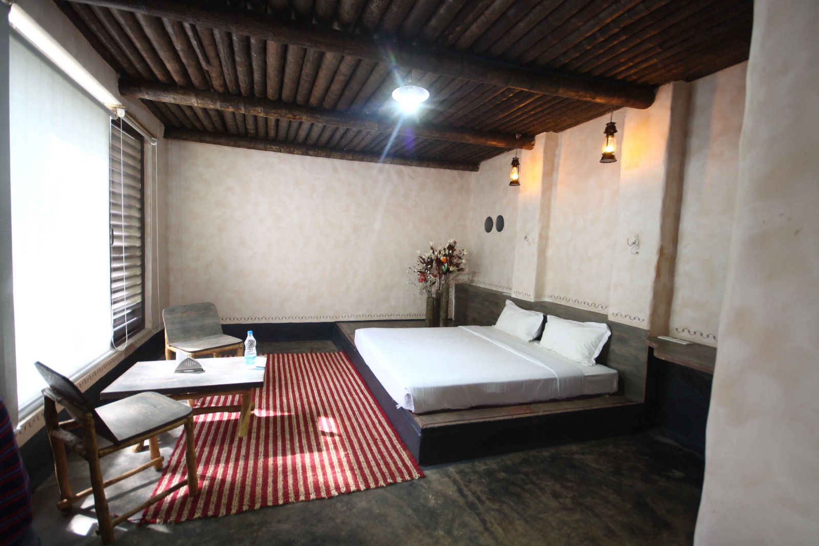 Interior of the comfortable room in our homestay in Chikmagalur opening to waterfalls 