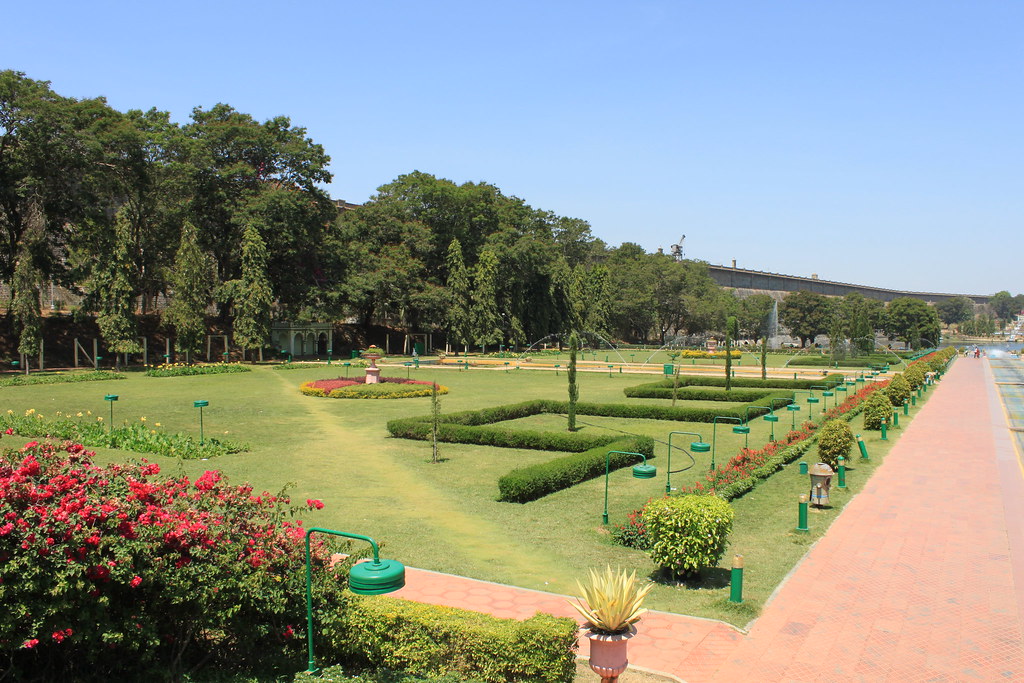 Traditional Mysore homestay exterior with vibrant flowers