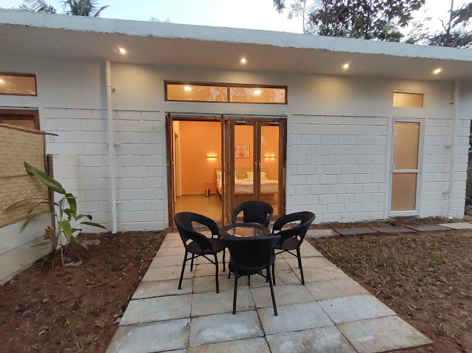 Suite balcony overlooking Kanakapura farmland  
