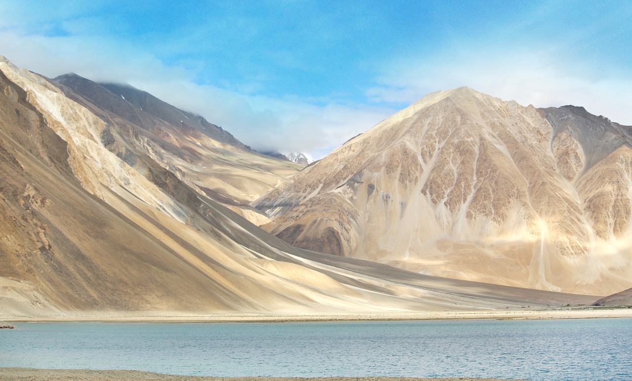 Charming Ladakhi homestay exterior with prayer flags